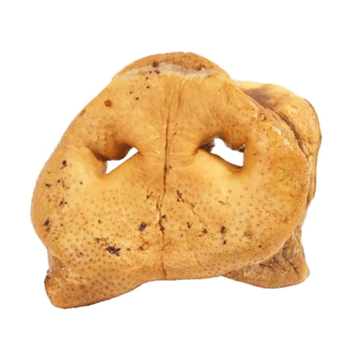Dehydrated pig snouts dog treats on a white background