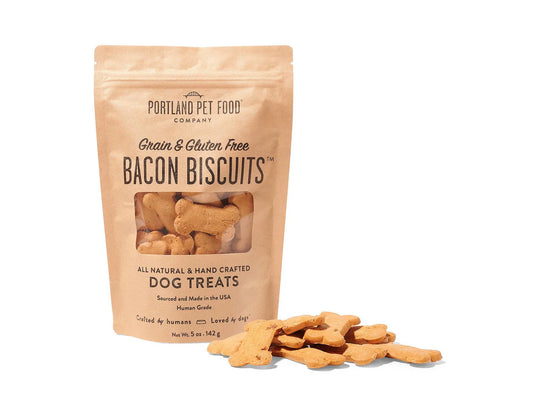 Bag of Portland Pet Food Company bacon biscuits dog treats on a white background